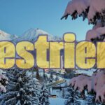 Panorama montano con boschi e montagne, simbolo di vacanze economiche nel 2026.